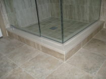 Dal Tile Floor with Caesarstone Dreamy Marfil caps on shower curb.